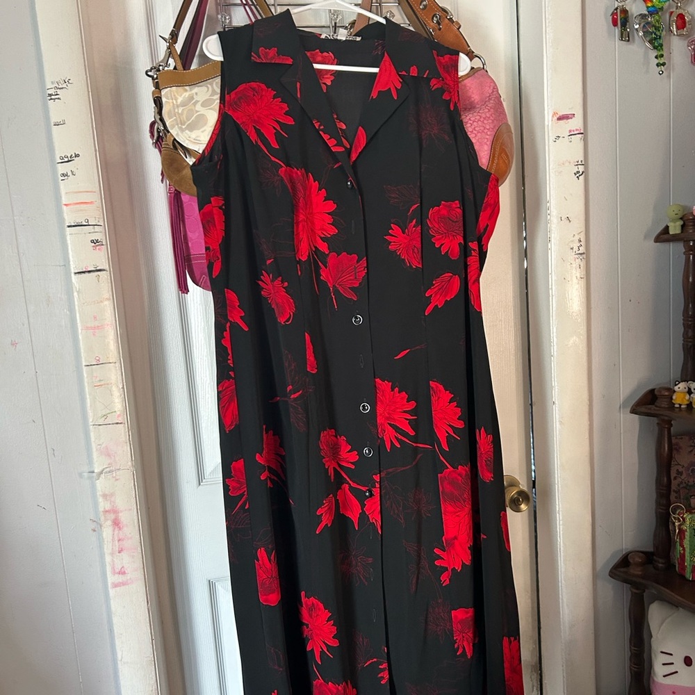 Long black sleeveless dress with  red flowers on it